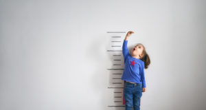 child-measure-height-tall-wall