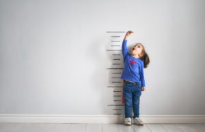 child-measure-height-tall-wall
