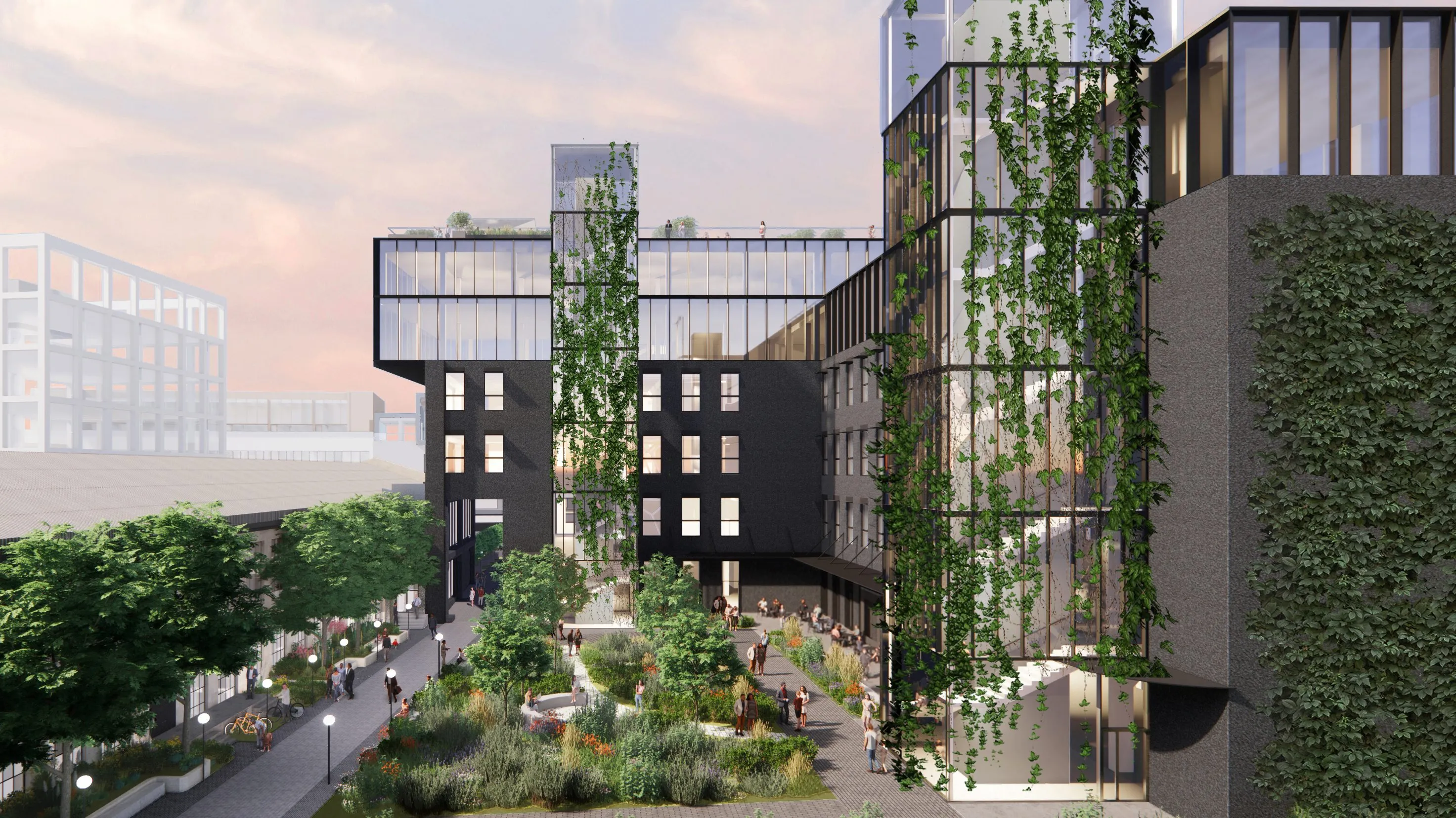 Modern urban courtyard with a multi-story glass-brick building, green ivy-clad walls, trees, and people strolling and sitting in planters.