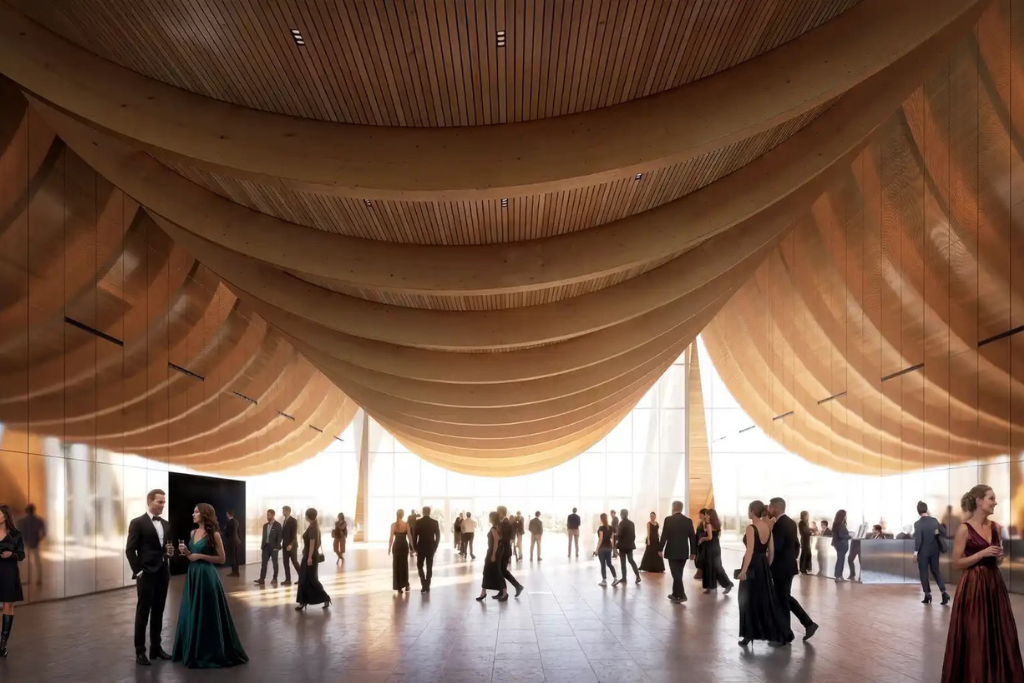 osijek_centre Guests in formal attire mingle in a sunlit hall with sweeping beige fabric canopies overhead, creating an elegant gala atmosphere.