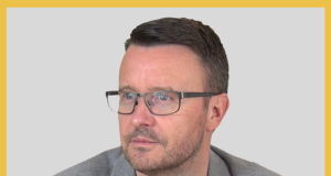 Portrait of a man with short dark hair and glasses, looking to the right; used for Kongres Magazine Interviews feature.