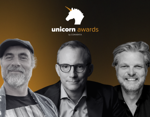 Unicorn Awards logo with three men posing against a dark orange gradient background, smiling faces visible.